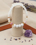 Diffuser-Armband FEDER – mit Lava-Perlen und goldener Feder